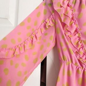 Pink dress with yellow polka dots and ruffle details